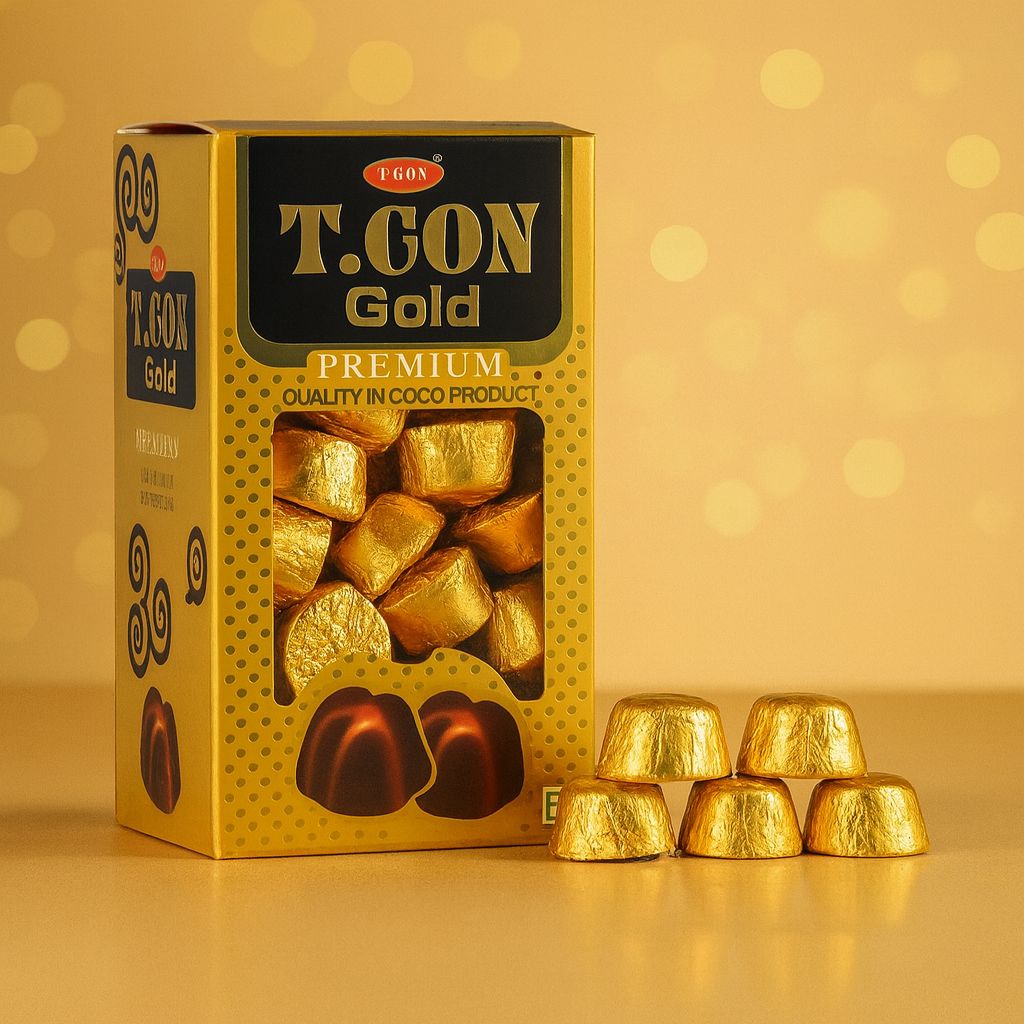 Yellow T.GON Gold box displaying premium center-filled milk chocolates wrapped in gold foil, with a stack of unwrapped gold chocolates in the foreground.